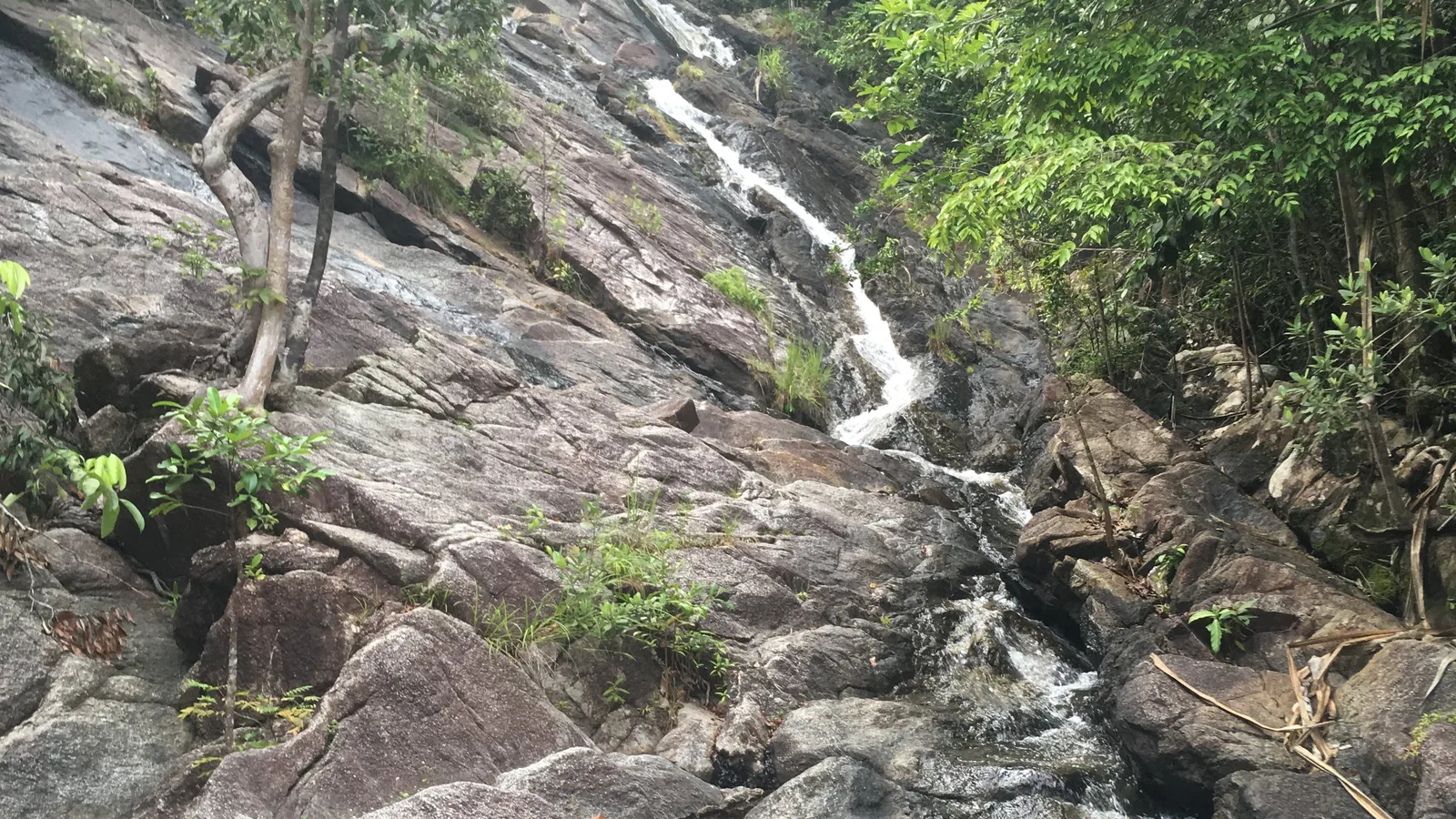 Phaeng Waterfall cascading over granite rock in the forest of Than Sadet-Ko Pha-ngan National Park